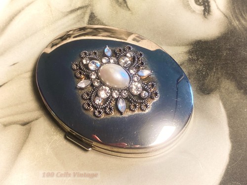 Shiny silver tone oval - , jeweled