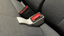Seat belt buckle guide for