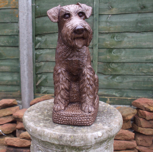 Sitting stone schnauzer dog - stone,