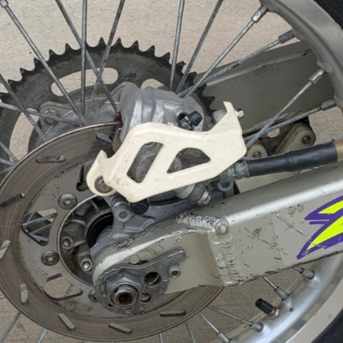 Oem rear caliper guard - rear,