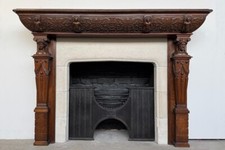 Antique Victorian Jacobean Revival oak fireplace surround with Limestone ingound