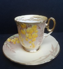 A beautiful Shelley "Laburnum" 12432 Court shape demitasse cup & saucer. C.1935.
