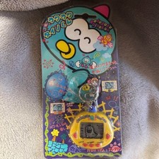 RakuRaku Dinokun Dinkie Dino Electronic Virtual Pet Yellow Dino Kun