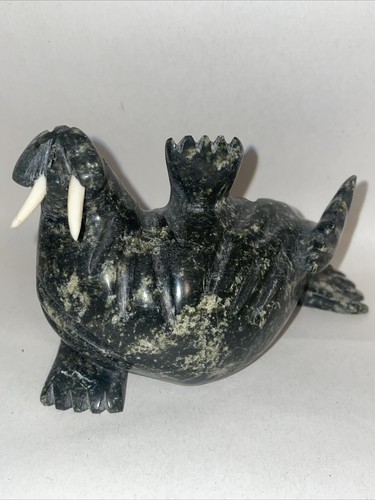 Waving walrus made by pits - a,
