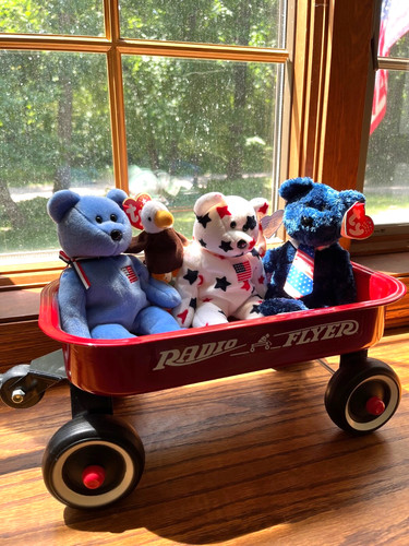 Red radio flyer wagon with - radio,
