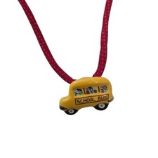 Vintage Flying Colors school bus ceramic pendant on red rope