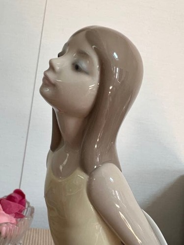 Girl doll with lladro hat