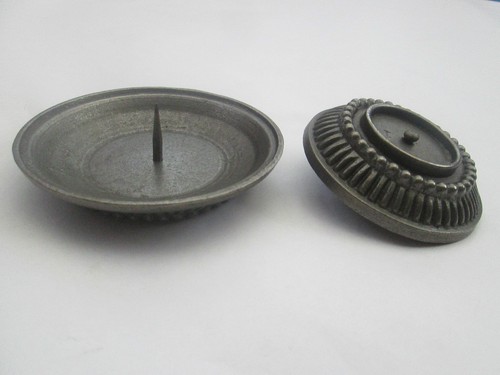Cast iron candle - holder, with