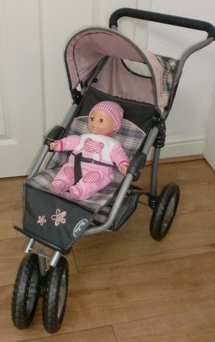 Three wheeled silver cross - wheeled,