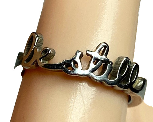 Silver tone cursive still - cursive,