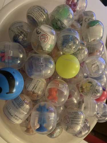 100 toy filled capsules - x,