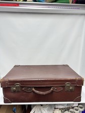 vintage brown leather suitcase, likely from the mid-20th century