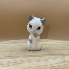 George Wade Sitting Siamese