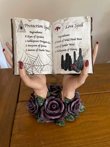Halloween hands holding spell - hands,