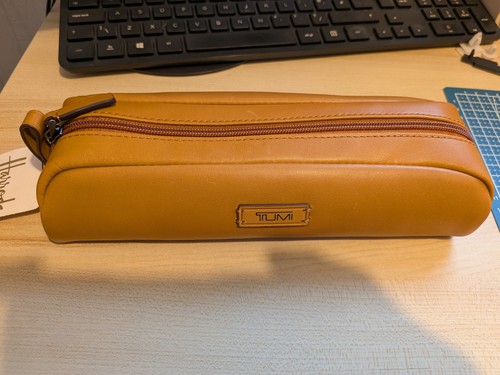 Tumi leather accents - leather, zip