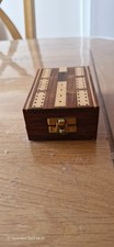 A cribbage set in a wooden
