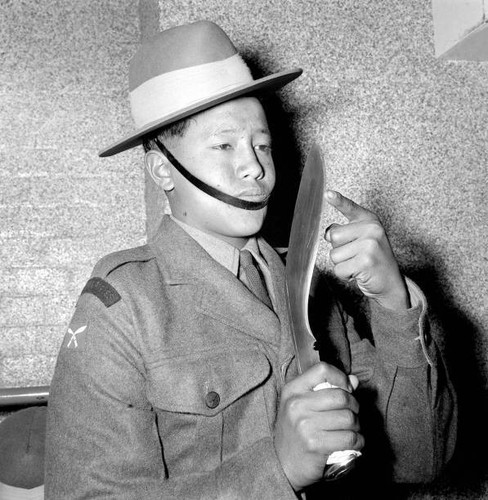 Gurkha soldier checks his