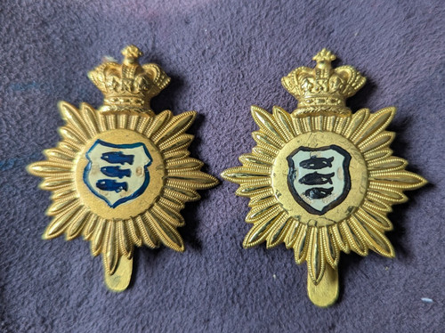 Two brass cap badges made - cap,