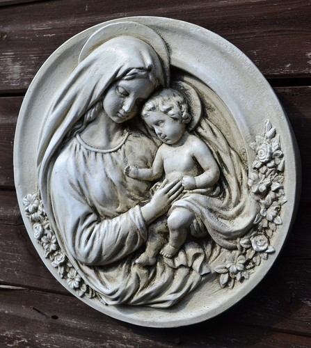 Madonna and child round wall - and,