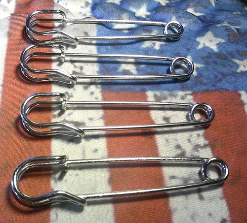 Four large silver tone stock - four,