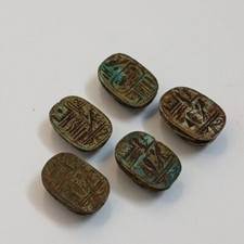 Antique-style Egyptian scarab stone with unique hieroglyphic detail