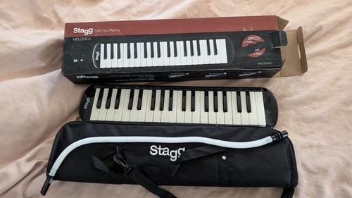 Black plastic melodica with - , 32