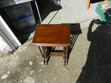a nest of 2 wooden nest of tables