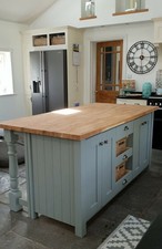 freestanding kitchen island breakfast bar with baskets and back turned posts