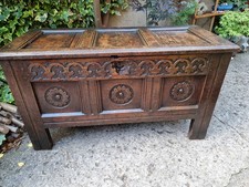17thC Oak coffer, with a triple panelled lid and foliate carved frieze