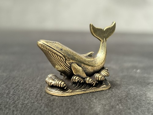 Solid brass whale - on, waves