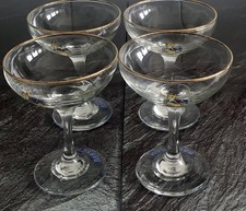 Set of 4  Vintage Babycham Glasses with Gold Rim and Logo