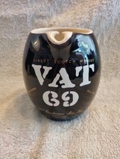 A NICE BLACK AND WHITE VAT 69 FINEST SCOTCH WHISKEY WADE REGICOR JUG