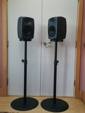 A pair of Genelec 8040a speakers with Genelec stands, and audio and power cables