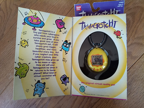 Tamagotchi usa 1997 - tamagotchi, yellow