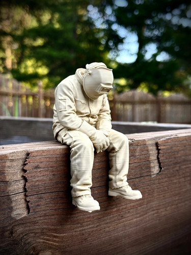 Welder sitting edge statue - welder,