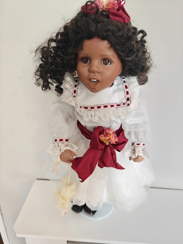 Boxed black porcelain doll - boxed,