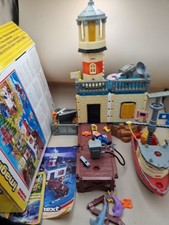 Boxed Fisher Price IMAGINEXT COASTAL PATROL STATION Boat, Lighthouse & Figures
