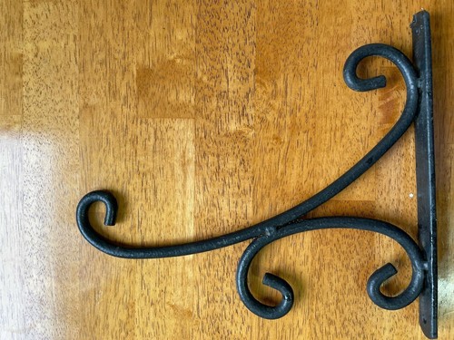 Ornate black hanging bracket - ornate,