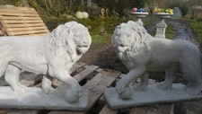 Pair of large standing lions in cast stone