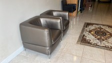 2 Natuzzi armchairs In Rusty