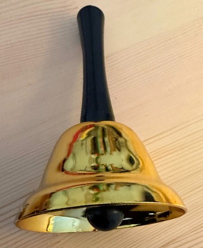 Golden hand bell with - hand,