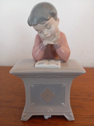Nao lladro boy sitting at - boy,