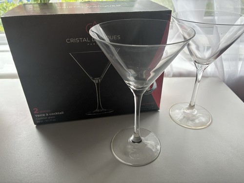 Two cocktail glasses with - two,