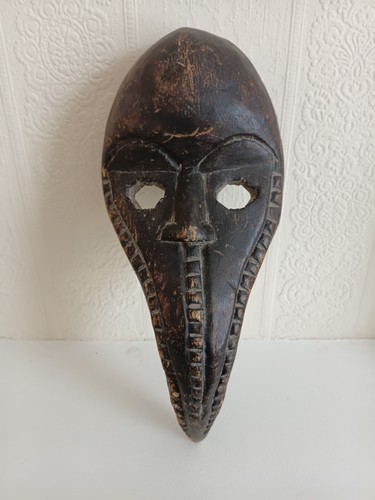 This rare dan bird mask - a,