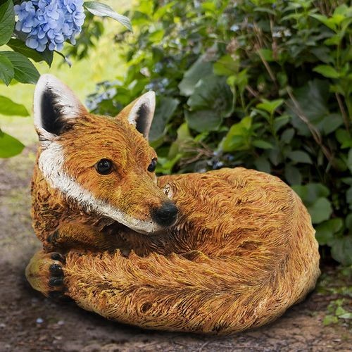 Curled fox ornament - up,