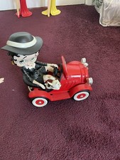 Betty Boop and Pudgy driving a