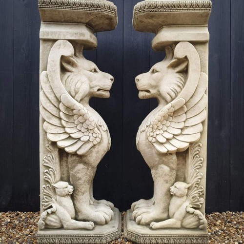 Pair winged lions stand - of,