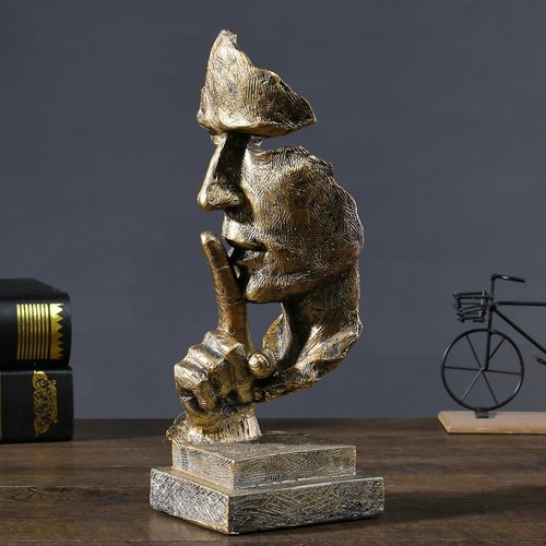 Gold silence face sculpture - silence,