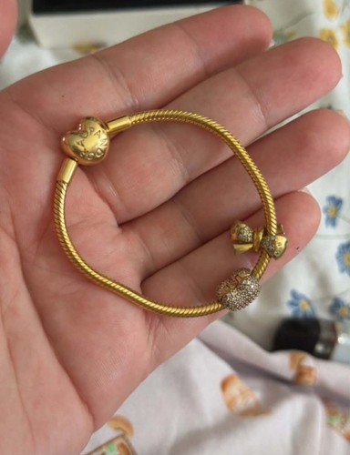 Pandora gold bracelet with - bracelet,