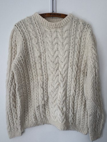 Hand knitted aran - hand,